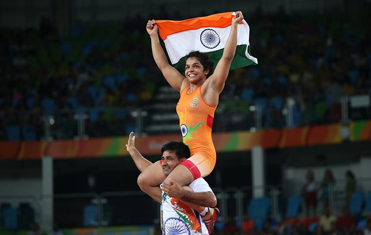 Sakshi Malik celebrates her win with her coach